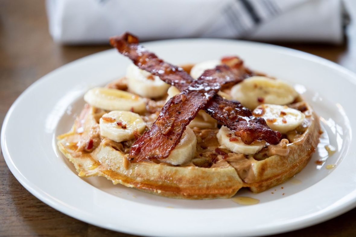 Waffle with bacon and bananas on top